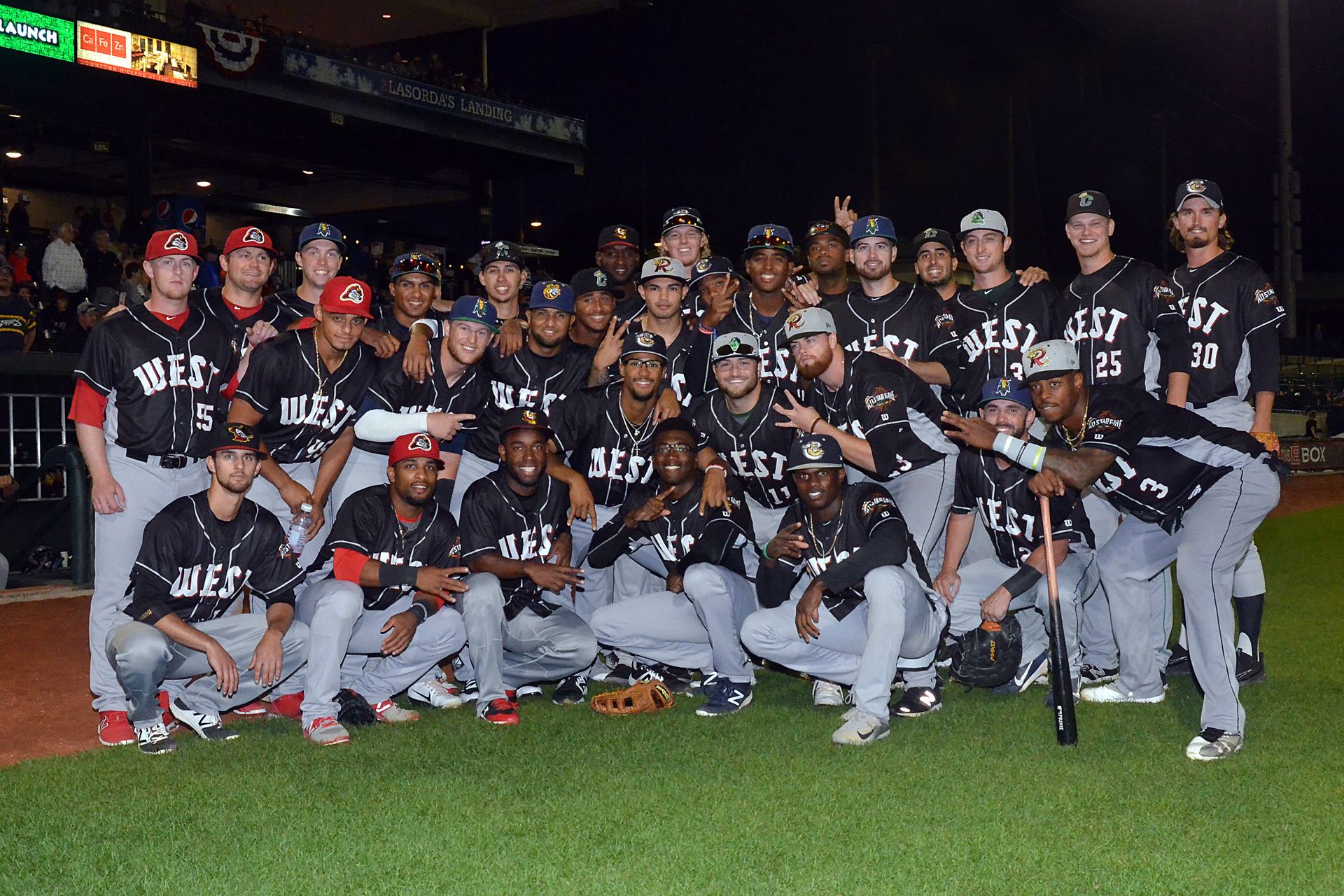 Coach Lofton with his players on the field after a win